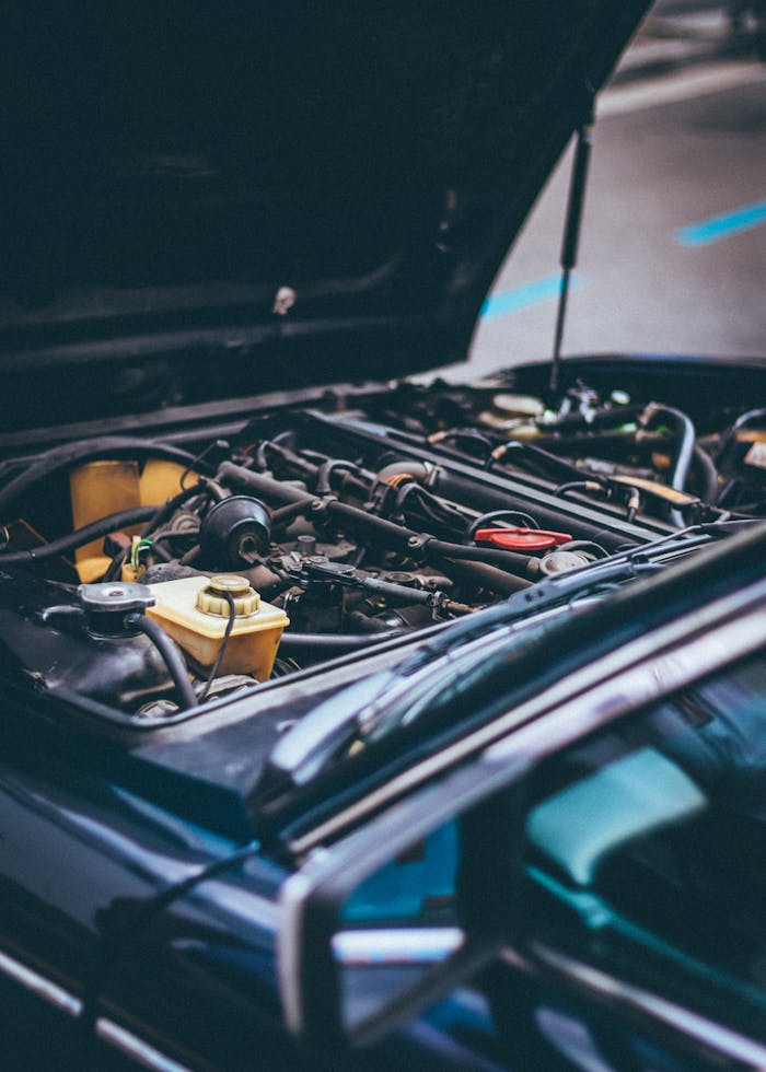 The Art of Drawing Readers In: Your attractive post title goes here Detailed view of an exposed car engine under maintenance in Barcelona.